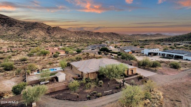 aerial view at dusk with a mountain view