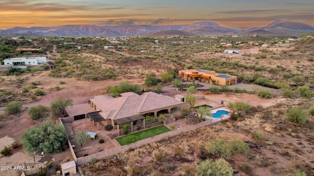 aerial view at dusk with a mountain view