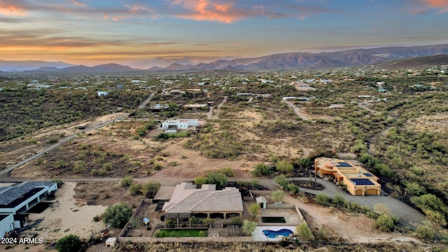 aerial view at dusk with a mountain view