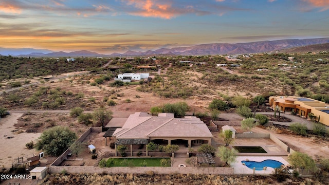 aerial view at dusk with a mountain view