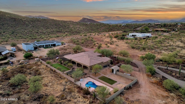 aerial view at dusk with a mountain view