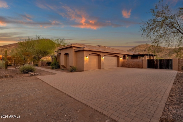 view of front of home featuring a mountain view and a garage