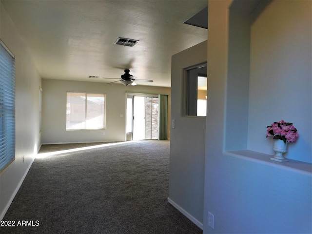 carpeted empty room with ceiling fan