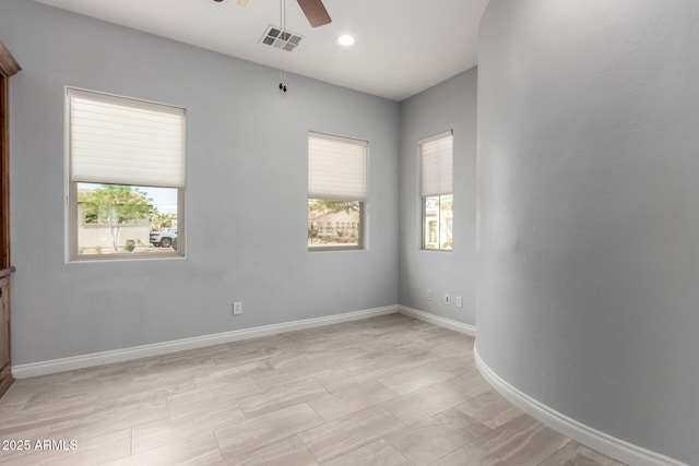 1407 E Artemis Trl, San Tan Valley, AZ 85140 - empty room with a wealth of natural light, visible vents, baseboards, and ceiling fan