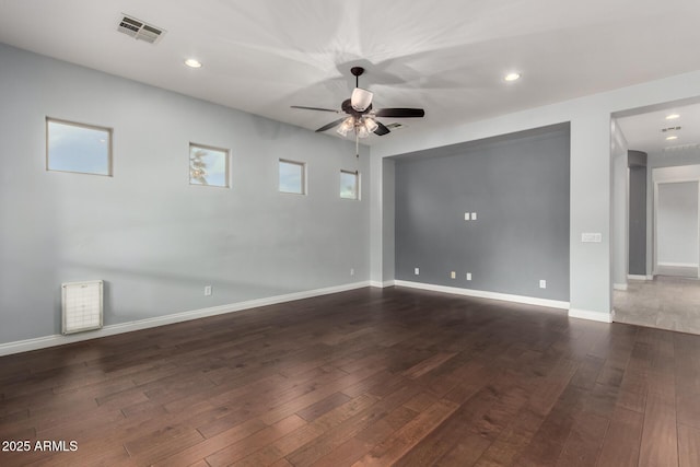 1407 E Artemis Trl, San Tan Valley, AZ 85140 - unfurnished room featuring dark wood finished floors, visible vents, baseboards, and a ceiling fan