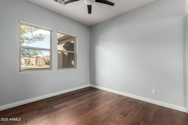 1407 E Artemis Trl, San Tan Valley, AZ 85140 - unfurnished room with dark wood-style floors, baseboards, and a ceiling fan
