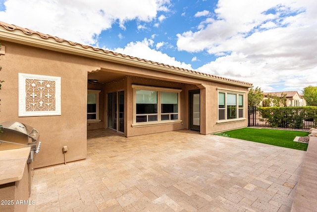1407 E Artemis Trl, San Tan Valley, AZ 85140 - rear view of property featuring stucco siding, a lawn, a patio, and fence