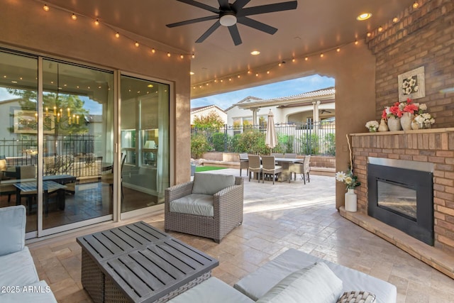 1407 E Artemis Trl, San Tan Valley, AZ 85140 - view of patio with outdoor dining area, fence, a ceiling fan, and an outdoor brick fireplace