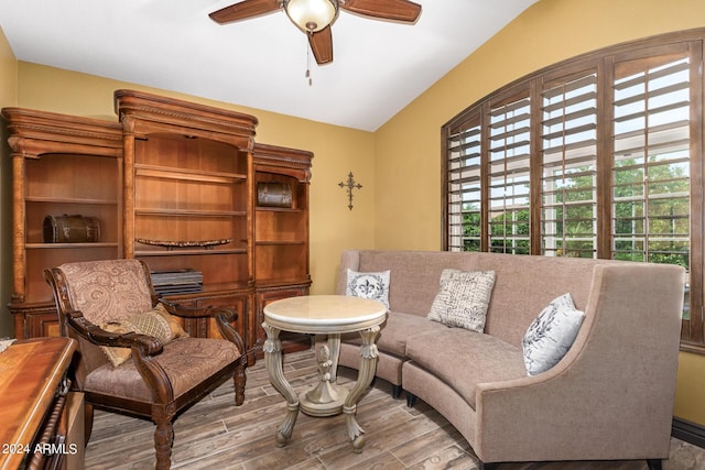 interior space featuring vaulted ceiling and ceiling fan