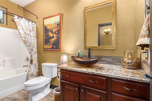 full bathroom with shower / bath combo, vanity, hardwood / wood-style flooring, and toilet