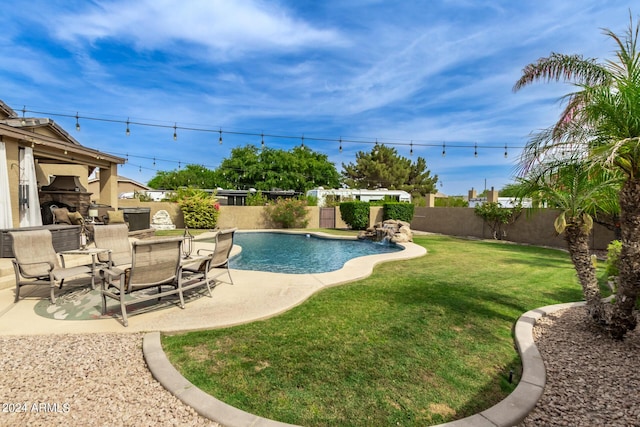 view of pool featuring a yard and a patio