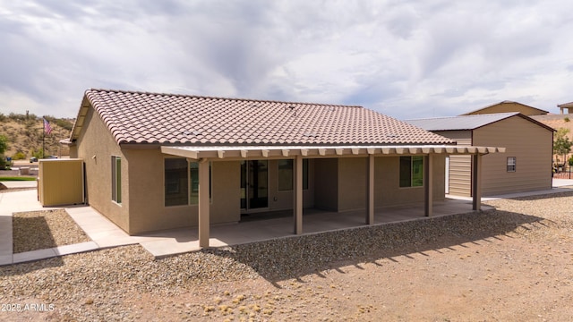 620 Vista Del Rio Ct, Wickenburg, AZ 85390 - rear view of property featuring stucco siding, a tile roof, and a patio area