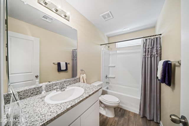 620 Vista Del Rio Ct, Wickenburg, AZ 85390 - full bathroom featuring wood finished floors, visible vents, vanity, and toilet