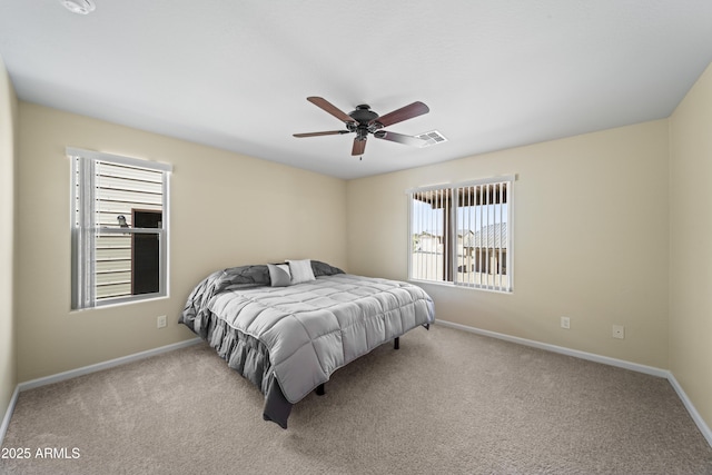 620 Vista Del Rio Ct, Wickenburg, AZ 85390 - bedroom featuring a ceiling fan, baseboards, carpet floors, and multiple windows