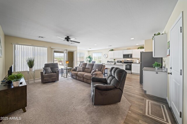 620 Vista Del Rio Ct, Wickenburg, AZ 85390 - living area featuring recessed lighting, wood finished floors, visible vents, and a ceiling fan