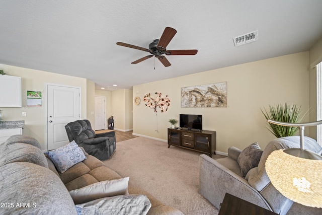 620 Vista Del Rio Ct, Wickenburg, AZ 85390 - living room featuring visible vents, a ceiling fan, baseboards, and light carpet