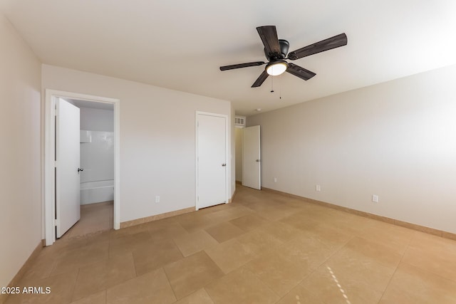 unfurnished bedroom with light tile patterned floors, a ceiling fan, and baseboards