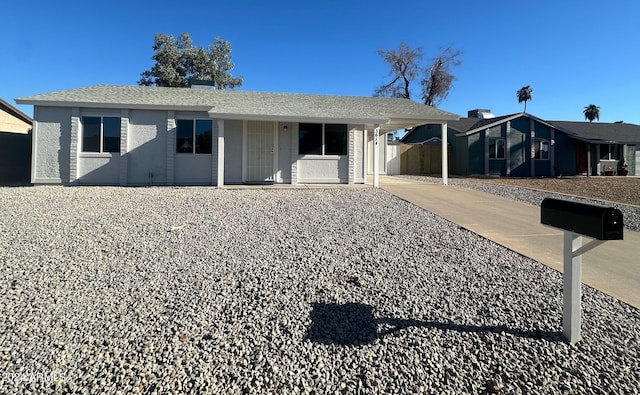 single story home featuring a carport