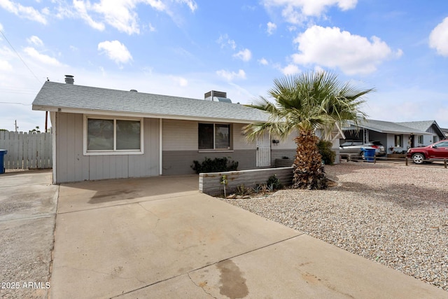 single story home featuring fence and driveway
