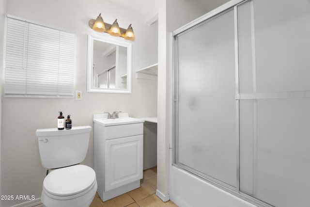 bathroom featuring toilet, tile patterned floors, shower / bath combination with glass door, and vanity
