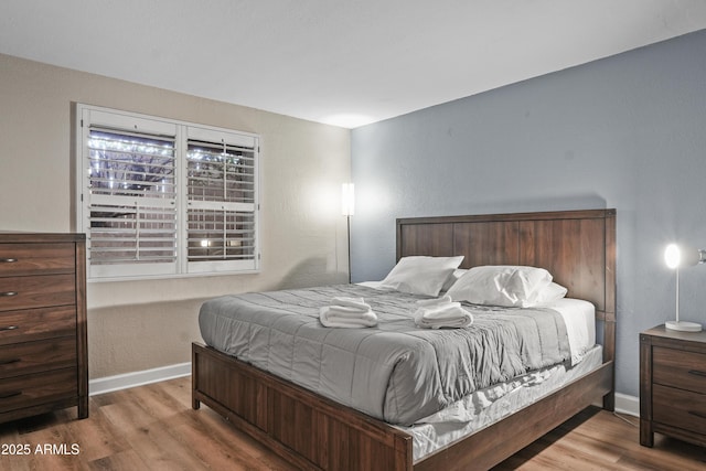 bedroom with light wood-type flooring