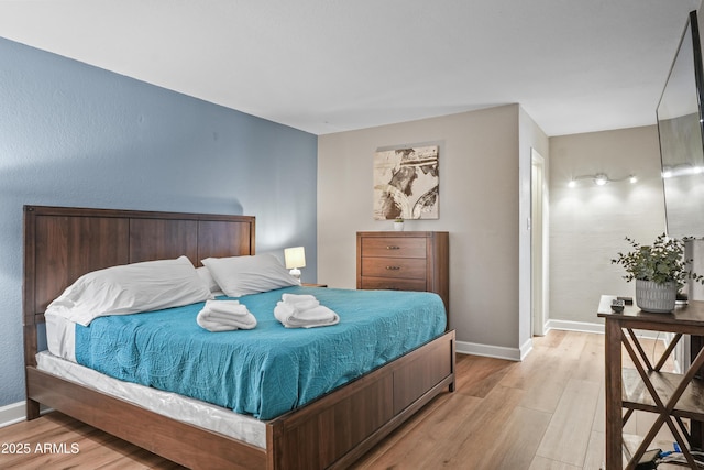 bedroom featuring light wood-type flooring