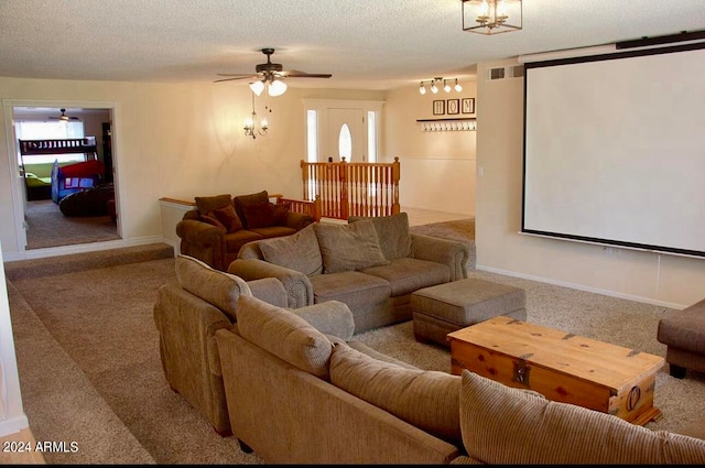 cinema featuring carpet flooring, ceiling fan, and a textured ceiling