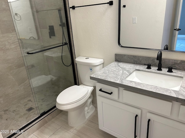 bathroom with vanity, toilet, and an enclosed shower