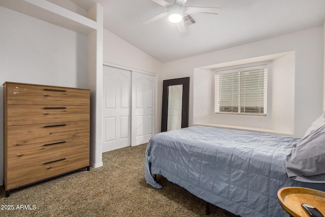 bedroom featuring lofted ceiling, carpet flooring, visible vents, a ceiling fan, and a closet