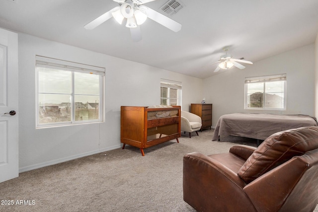 bedroom with light colored carpet, a ceiling fan, baseboards, vaulted ceiling, and visible vents