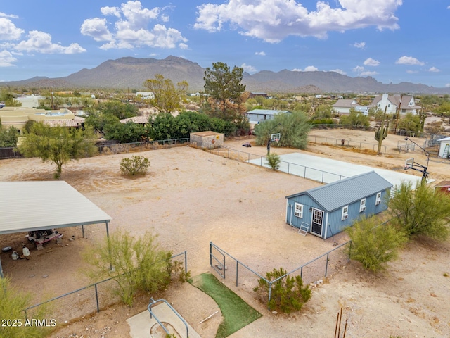 birds eye view of property featuring a mountain view