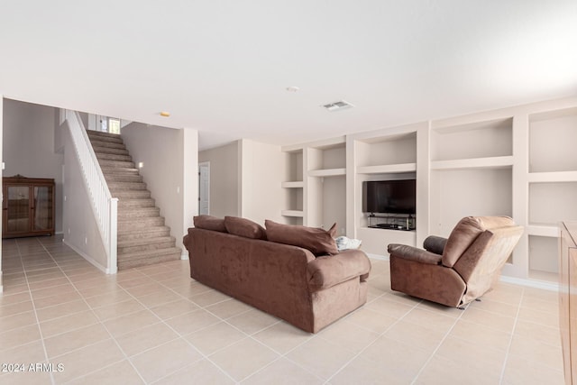 tiled living room with built in shelves