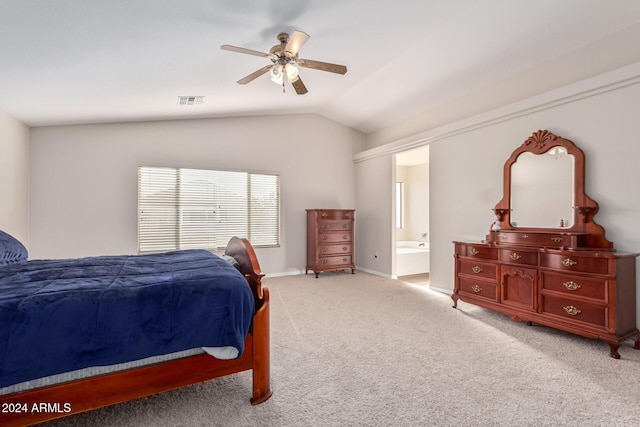 carpeted bedroom with connected bathroom, ceiling fan, and lofted ceiling