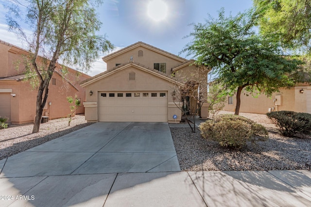 front of property with a garage