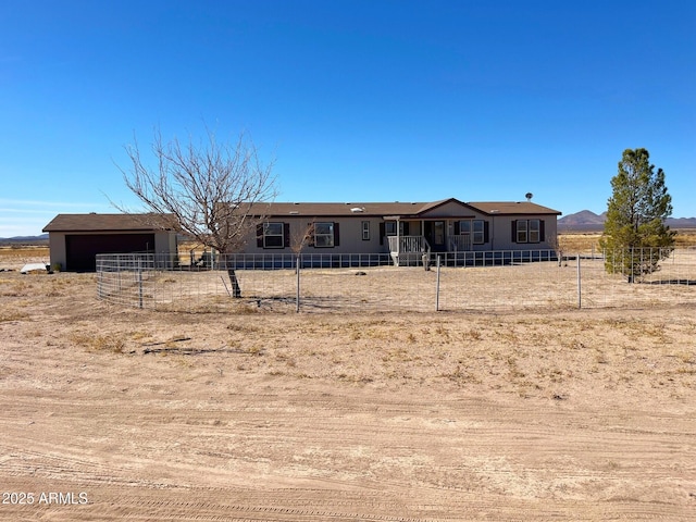 manufactured / mobile home with an outdoor structure and fence