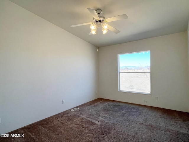 unfurnished room featuring carpet floors and a ceiling fan