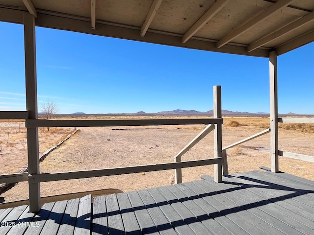 view of yard featuring a deck with mountain view