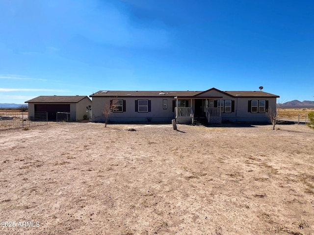 back of property featuring fence