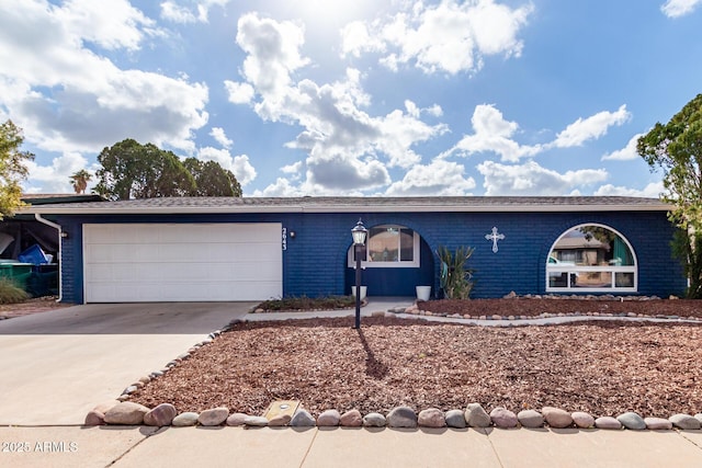 ranch-style home featuring a garage