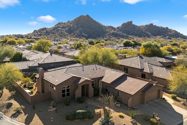 birds eye view of property featuring a mountain view