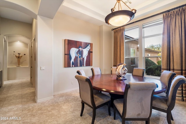 dining room featuring a tray ceiling