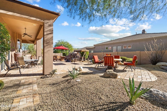 view of patio featuring ceiling fan