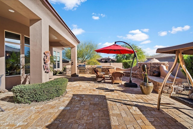 view of patio with an outdoor kitchen