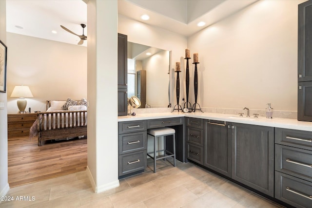 bathroom with ceiling fan, tile patterned flooring, and vanity