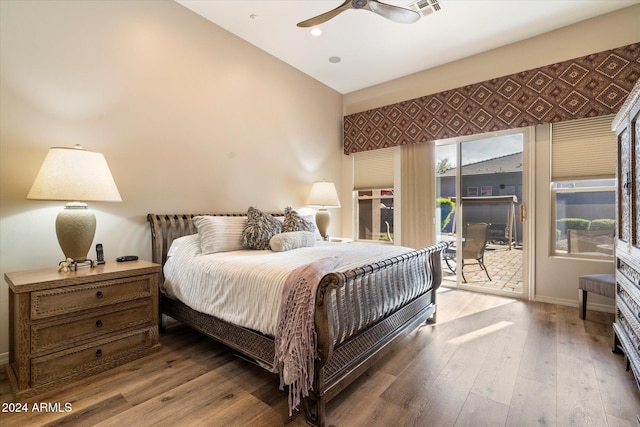 bedroom with access to outside, vaulted ceiling, ceiling fan, and hardwood / wood-style flooring