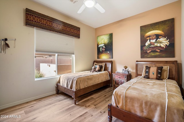 bedroom featuring ceiling fan and light wood-type flooring