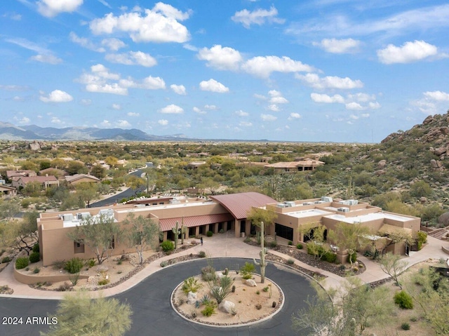 drone / aerial view featuring a mountain view