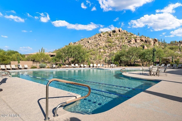 view of swimming pool with a patio area