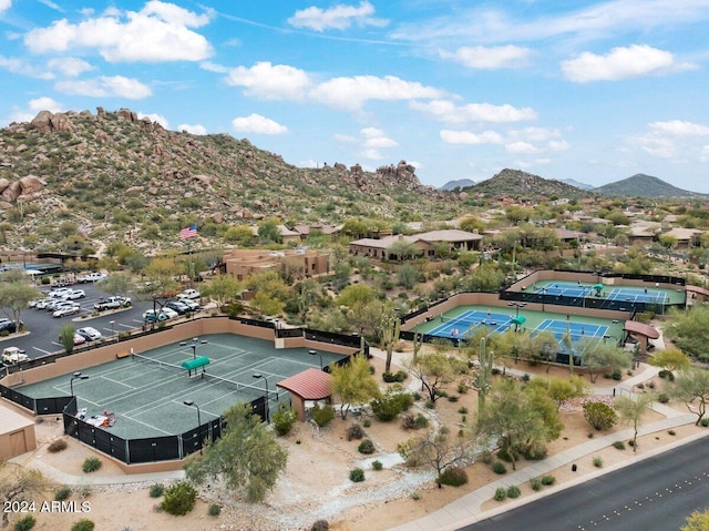 birds eye view of property with a mountain view