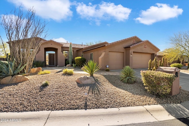 view of front of property with a garage